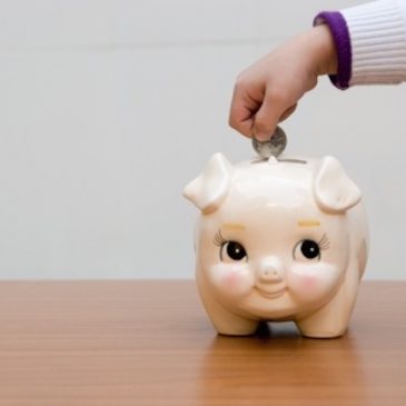 piggy bank with hand